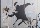 20211116-IMG 2767  Banksy - Le lanceur de fleurs - Bethléem - Palestine - 2003 - The Word of Banksy -  Paris 9eme - France - le 16/11/2021 : PARIS, STREET ART, STREET ART-BANKSY
