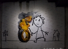 20211116-IMG 2785  Banksy - Pneu en feu - Bristol - Royaume Uni - 2016 - The Word of Banksy -  Paris 9eme - France - le 16/11/2021 : PARIS, STREET ART, STREET ART-BANKSY